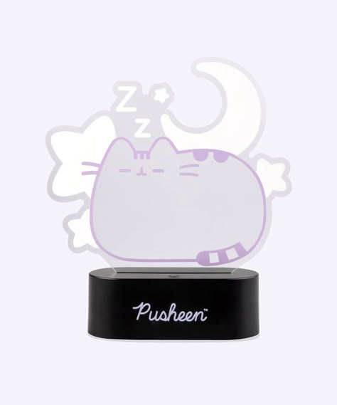 Brighten up your space with The Pusheen Dreams Lamp! This adorable lamp is perfect for a cozy reading session, as a desk lamp, or as a nightlight. LED Lamp includes on/off switch on top of base. Can be powered by micro USB-C cord (included) or 3 AAA batteries. Batteries not included. Dreams Lamp measures approximately 6.5" tall, 7.5" long. Content ABS. Methacrylate. Pusheen Bedroom, Aesthetic Pusheen, Pusheen Stuff, Pusheen Shop, Alphabet Sounds, Pusheen Cute, Pusheen The Cat, Cat World, Xmas Wishes