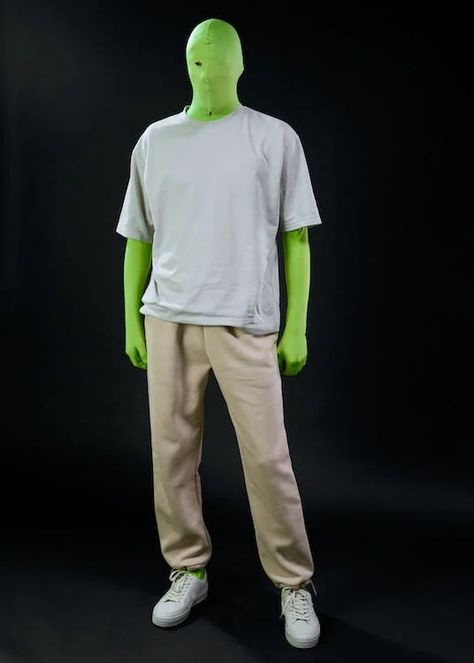 A Person in a Green Screen Suit Wearing a Gray Shirt and Beige Trousers · Free Stock Photo Green Screen Suit, Beige Pants, Gray Shirt, Chroma Key, Studio Shoot, Green Screen, Grey Shirt, White Sneakers, Free Photos