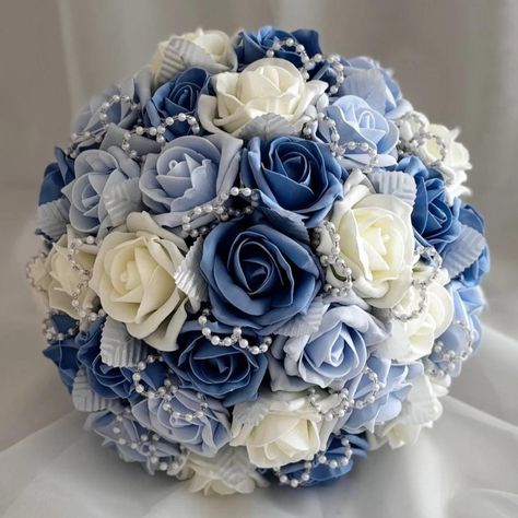 Artificial Wedding Bouquet made with Blue and Ivory Roses with Pearl and Crystal Loops  All Colours Available, see below. A beautiful handmade wedding bouquet, created using high quality artificial foam roses, which look so realistic. I have incorporated small pearl  and crystal loops with small white leaves throughout the bouquet. The handle has then been wrapped in white satin ribbon and just to add a special little touch i have attached a beautiful diamanté heart with a small ribbon bow to th Small Ribbon Bow, Handmade Wedding Bouquet, Artificial Wedding Bouquets, Flower Girl Bouquet, Ivory Roses, White Leaves, Foam Roses, Blue Bouquet, Wedding Bridal Bouquets