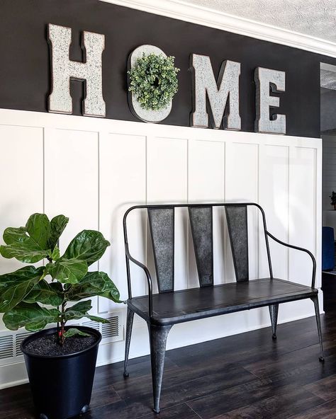 Black and white board and batten wall with HOME sign over metal bench and fiddle leaf fig. Entryway Black And White, White Board And Batten Wall, Black And White Board, Batten Wall Ideas, Board And Batten Wall Ideas, White Board And Batten, Accent Wall Entryway, Batten Wall, Black Accent Walls