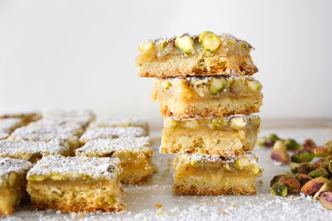 These easy lemon bars have everything the traditional ones do – tang, sweetness and a butter-y rich base – plus the added benefit of pistachios folded into the filling and the crust They're just delightful. Ny Times Recipes, New York Times Recipes, Lemon Pistachio, Nyt Recipes, Lemon Bars Easy, Bars And Squares, Lemon Bars Recipe, Best Christmas Cookies, Nyt Cooking