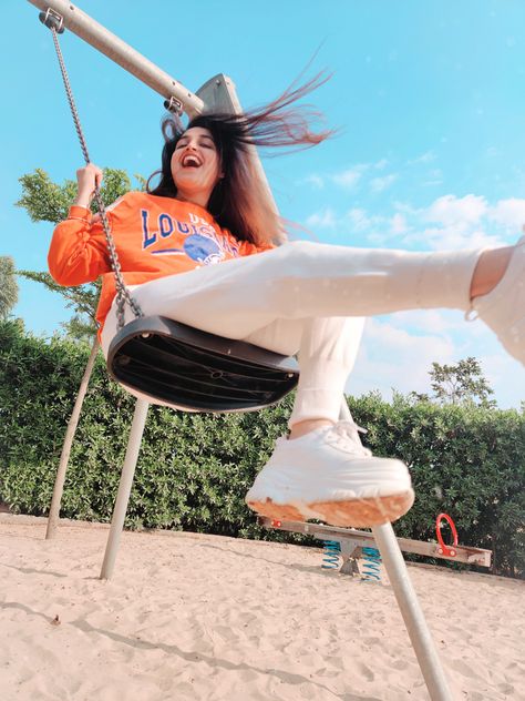 There is an unmatchable level of happiness in being silly and childish! Never take life too seriously and don’t forget to have a good time!  Tell me the most child like things that you have done recently?  #goodtimes #swing #intheair #play #fun #sharehappiness #childhoodmemories #innerhappiness #selflove #trending #march2020 #dikshavohra Childish Photoshoot, Swinging Pose Reference, Swings Photography, Swing Photoshoot Ideas, Playground Shoot, Swing Poses, Playground Aesthetic, Playground Photoshoot, House Photoshoot