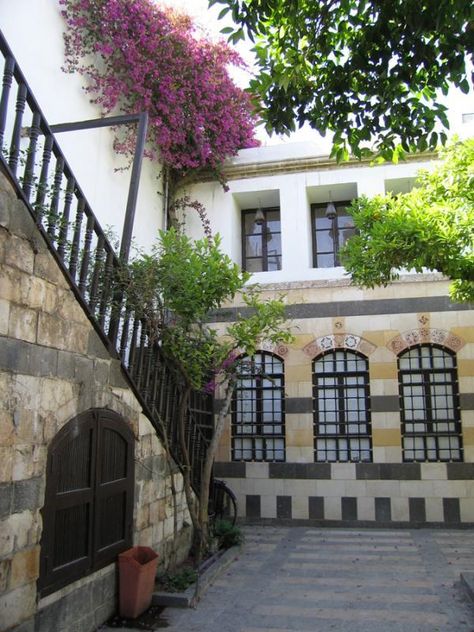 A yard in an old house of old town in Damascus. Damascus House, Syria Before And After, Contemporary Staircase, Damascus Syria, Culture Day, Restaurant Interior Design, Bougainvillea, Islamic Architecture, This Is Us Quotes