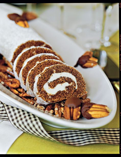 A tasty, twirly homemade pumpkin roll cake that makes for an unforgettable presentation. Spice Cake Roll, Pumpkin Spice Pecans, Pumpkin Roll Cake, Pumpkin Rolls Recipe, Pumpkin Spice Recipe, Pumpkin Roll, Thanksgiving Food Desserts, Sweet Pumpkin, Roll Recipe