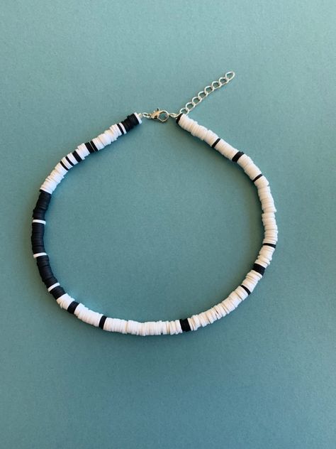 https://www.etsy.com/listing/969947175/black-and-white-heishi-choker-necklace?ref=shop_home_active_7&frs=1&crt=1 Outer Banks Black And White, Kiara Outer Banks Necklace, Kiara Necklace, Outer Banks Kiara, Kiara Outer Banks, Beach Choker, Outer Banks Outfits, White Choker Necklace, Polymer Clay Beaded Necklace