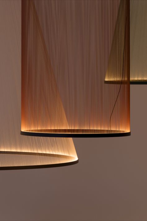 ARRAY is a collection of pendant lamps in different sizes, a technical exploration of the potential of thread to create ethereal dynamic hanging light sculptures. Balanced by the weight of the aluminium rings, the threads are held in tension to create a delicate, lightweight form. #lighting #lightingdesign #interiordesign Mid Century Modern Lamp, Home Decor Cozy, Andermatt, Lighting Concepts, Kitchen Home Decor, Light Sculpture, Light Architecture, Light Installation, Lighting Inspiration