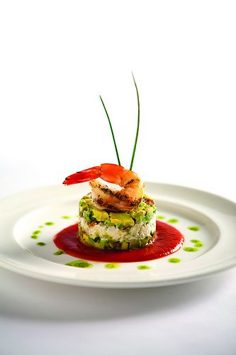 Our chilled Gulf shrimp with jumbo lump crab layered with fresh diced avocado and local tomato, and finished with a spicy tomato coulis, is one of our delicious signature appetizers served at Criollo Restaurant & Lounge. Gastronomic Food, Fine Dining Plating, Gourmet Food Plating, Food Plating Techniques, Shrimp Appetizers, Constant Contact, Fine Dining Recipes, Food Garnishes, Blue Crab