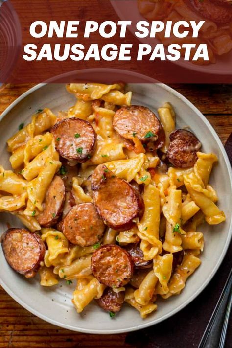 One Pot Spicy Sausage Pasta is pan-seared andouille smoked sausage, campanelle pasta, and a creamy, cheesy, spicy sauce. One Pot Smoked Sausage Pasta, One Pot Smoked Sausage, Smoked Sausage Recipes Pasta, Italian Sausage Recipes Pasta, Spicy Pasta Recipes, Andouille Sausage Recipes, Campanelle Pasta, Bologna Recipes, Creamy Sausage Pasta