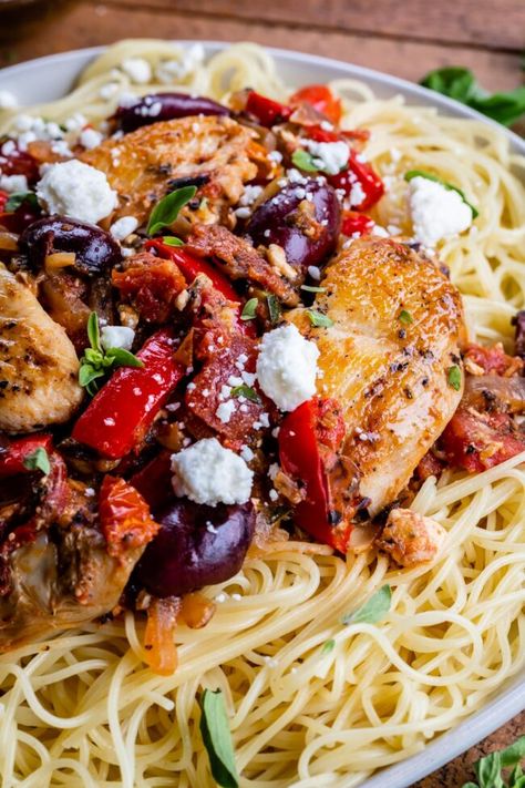 Greek Pasta with Chicken (and Zoodles) from The Food Charlatan. This Greek Pasta with Chicken can also be made with zoodles for a healthy twist! Chicken is seared and paired with a stovetop veggie saute: tomatoes, red bell peppers, artichokes and Kalamata olives. It's super healthy and incredibly delicious! This weeknight dinner recipe is done in 30 minutes! #greek #pasta #chicken #kalamata #olives #artichoke #sundriedtomatoes #easy #recipe #angelhair #zoodles #healthy #lowcarb #30minute #dinner Saute Tomatoes, Veggie Saute, Chicken And Zoodles, Healthier Dinners, Zoodles With Chicken, Baked Greek Chicken, Pasta With Chicken, The Food Charlatan, Pasta Chicken