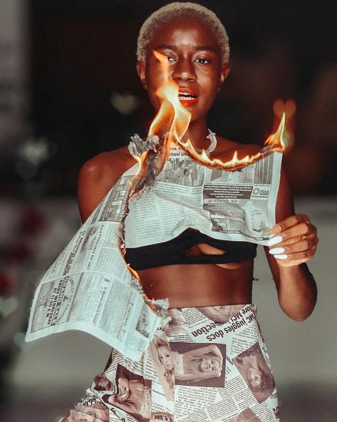 Fire photography creative inspiration style model newspaper blackwoman Newspaper Fire, Burning Newspaper, Photography Newspaper, Newspaper Fashion, Creative Poses, Fire Photography, Pose Idea, Fashion Creative, Photo Idea