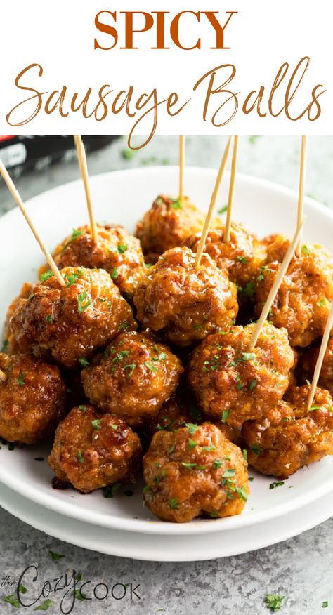 Spicy sausage meatballs on a white plate. Each meatball has a toothpick in it. Spicy Sausage Balls, Best Sausage Ball Recipe, Easy Sausage Balls Recipes, Cream Cheese Sausage, Sausage Balls Bisquick, Cream Cheese Sausage Balls, Sausage Balls Recipe, Sausage Meatballs, Sausage Balls