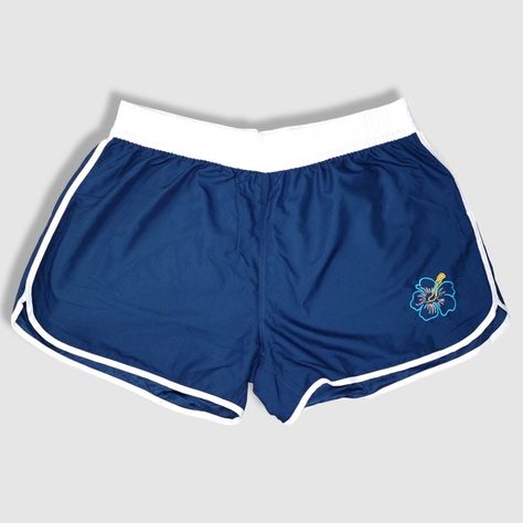 Navy blue shorts with teal hibiscus flower in the front. Hawaii and Hawaiian islands in teal, in the back. Made of 100% microfiber polyester. Designed and shipped from Hawaii and made in Vietnam. Colors and fabric may vary from picture depending on cut.