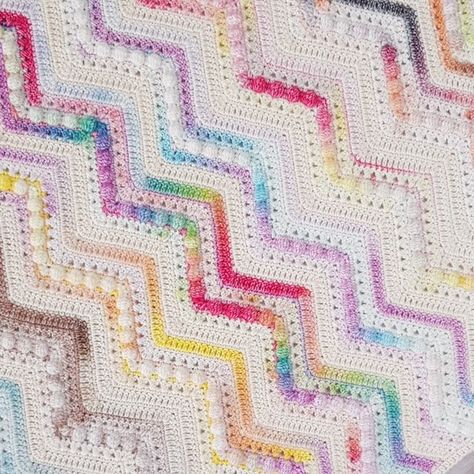 LittlePawsCrochet on Instagram: "🌸🍭My blanket is finished🎉 @scheepjes Stone Washed Minerals used for the beautiful Hugs & Kisses Blanket by Jeanne Steinhilber 💜 

I wanted to test all the 10 colours in the same blanket, so I chose a striped one to be able to show them in different stitches. Since I've made this pattern before, I knew I would love making it. 

It's out of my comfort zone using variegated yarn, and my perfectionist brain likes to have more control over the colours🫣😅 but it was so exciting to see all the colours appear!
The pattern is so lovely, and I truly enjoy making it.

I tried to capture the colours as they are in real life, but it's really hard. This is as close as I could get. 

I used Stone Washed Moonstone to separate the Mineral stripes, so if you are familia Variegated Yarn Patterns, Variegated Yarn Crochet, Out Of My Comfort Zone, Hugs Kisses, Different Stitches, Variegated Yarn, Hugs And Kisses, Crochet Ideas, Choose Me