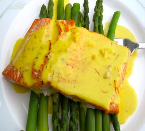 Salmon with Coconut Saffron Sauce  I think I will make one change-grill the asparagus and the salmon.  Maybe pan seared with a lot of butter-could it hurt? Saffron Sauce, Colombian Recipes, Saffron Recipes, Colombian Food, Coconut Milk Curry, Eggplant Recipes, Grilled Salmon, Fish Dishes, Seafood Dishes