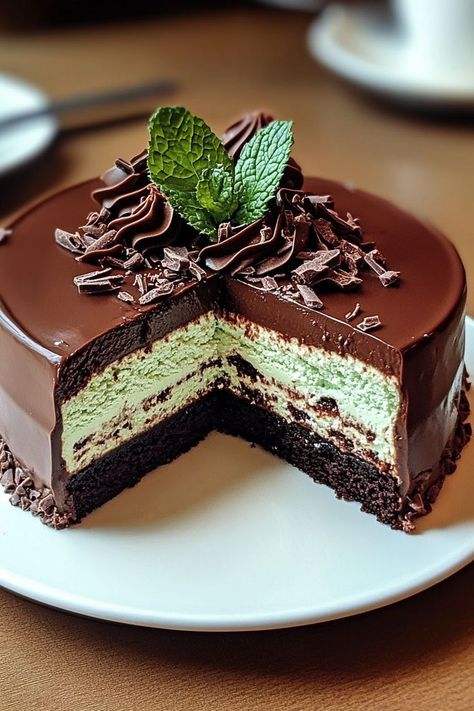 Experience the ultimate dessert indulgence with this Mint Chocolate Cheesecake Cake! Combining the richness of chocolate with a refreshing hint of mint, this cake features layers of smooth cheesecake and fluffy chocolate cake. Topped with a velvety mint ganache, it's perfect for any celebration. Surprise your loved ones with this deliciously unique dessert, and watch it become an instant favorite. This recipe is easy, stunning, and guaranteed to impress! Mint Ganache, Celebration Cheesecake, Chocolate Ganache Cheesecake, Chocolate Cheesecake Cake, Unique Cheesecake, Mint Chocolate Cheesecake, Fluffy Chocolate Cake, Mint Chocolate Cake, Mint Cheesecake