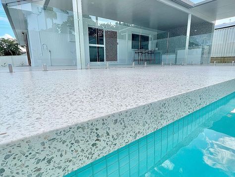 Polished Concrete Around Pool, Tiled Pool Area, Concrete Around Pool Ideas Design, Polished Concrete Pool Surround, Honed Concrete Pool, Terrazzo Pool Deck, Honed Concrete Pool Surround, Santorini Backyard, Concrete Pool Surround