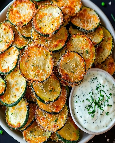 Make crispy baked zucchini chips with a tangy Greek yogurt ranch dip. A healthy, delicious snack perfect for any occasion! Yogurt Ranch Dip, Greek Yogurt Ranch Dip, Taco Cupcakes, Baked Zucchini Chips, Yogurt Ranch, Greek Yogurt Ranch, Crispy Zucchini, Zucchini Chips Baked, Baked Zucchini