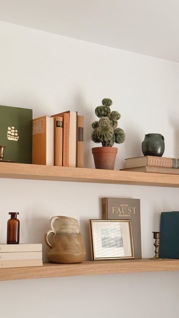 Books Floating Shelves, Oak Floating Shelves Living Room, Thrifted Shelf Decor, Living Room Floating Shelves Above Couch, Floating Shelf Above Couch, Floating Shelves Boho, Floating Shelves Above Couch, Shelf Above Couch, Uni Room Ideas Uk