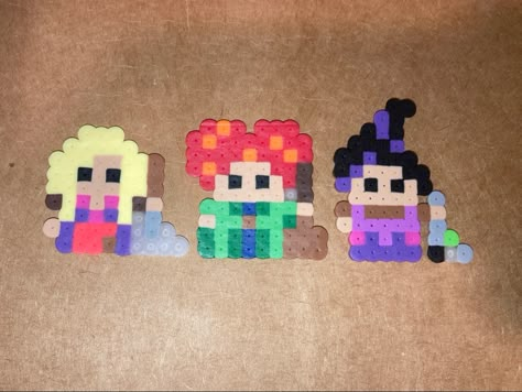 hocus pocus winifred sanderson sarah sanderson mary sanderson thackery binx dani characters ideas perler bead pixel art Sanderson Sisters Perler Beads, Hocus Pocus Pixel Art, Hocus Pocus Perler Bead Patterns, Hocus Pocus Perler Beads, Hocus Pocus Winifred, Melted Bead Crafts, Easy Perler Bead Patterns, Melty Bead Patterns, Easy Perler Beads Ideas