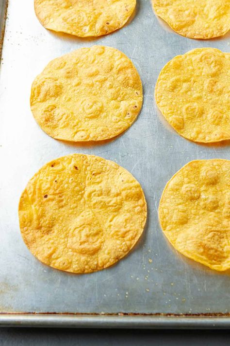 Golden brown crispiness in every bite. Make a batch of homemade baked tostada shells and keep them on hand for easy dinners and breakfasts. | In oven | Corn tortillas Baking Corn Tortillas In Oven, Oven Baked Tortillas, Baking Tortillas In The Oven, Crispy Corn Tortillas In Oven, Bake Corn Tortillas In Oven, Bake Tortillas In Oven, Oven Baked Tostadas, How To Make Tostadas In The Oven, Corn Tortilla Tostada