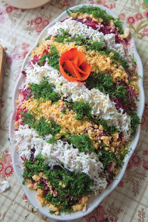 Layered Herring Salad (Selyodka Pod Shuboy from Latvia) - Salt-cured herring becomes a lavish centerpiece when layered with apples and a sour cream—mayonnaise dressing in this beautiful composed salad. ..... Herring Salad Recipe, Herring Salad, Russian Dishes, Ukrainian Recipes, European Food, Russian Recipes, How To Cook Quinoa, Sochi, Food Decoration