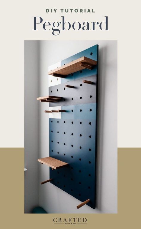 This DIY pegboard is spray painted with a fun geometric design to give it a modern look. Add a pegboard to a bedroom, office, craft room, kids space, or home gym. The options are limitless! Pegboard Partition, Pegboard Color Ideas, Peg Board Office Ideas, Pegboard Gear Wall, Cool Pegboard Ideas, Wood Pegboard Wall, Diy Giant Pegboard, Creative Pegboard Ideas, Modern Pegboard Wall