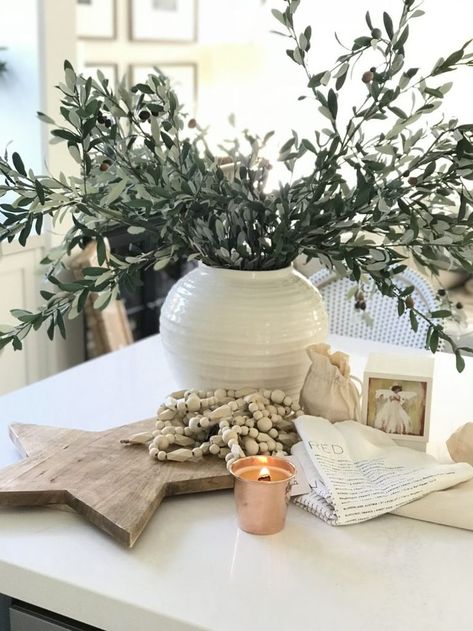 Time for Christmas decorating! White vase with olive branches, wooden garland, and candle. #christmasdecor Olive Branch Christmas Decor, Olive Branch Decor Ideas, Vase With Olive Branches, Olive Branch Garland, Wooden Garland, Vase With Branches, Tv Ideas, Christmas Vases, Diy Blanket Ladder