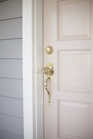 Beach Cottage Exterior, Pink Front Door, Black Interior Doors, Three Birds Renovations, Cottage Exterior, Pink Door, Three Birds, Grey Houses, Front Entry Doors