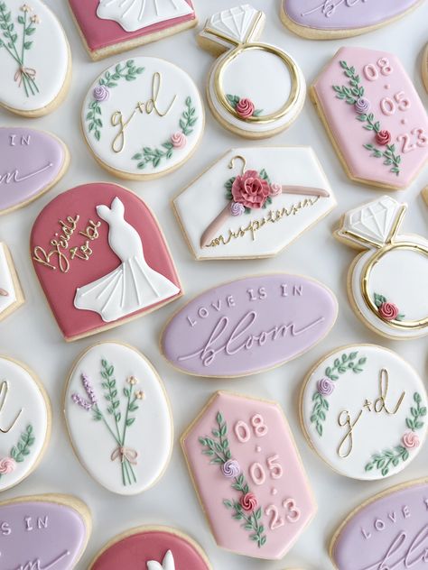 Bridal shower cookies, love is in bloom, love is in bloom cookies, purple and pink color palette Floral Bridal Shower Theme Brunch, Bridal Shower Baked Goods, Love Is In Bloom Bachelorette, Bridal Shower Ideas Colorful, Love Is In Bloom Cupcakes, Love Is In Bloom Desserts, Spring Bridal Shower Cookies, Floral Bridal Cookies, Love Is In Bloom Shower Theme