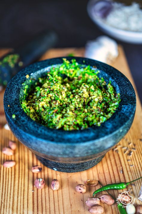 a close up of a granite mortar with mirchi ka thecha Thecha Recipe, Homemade Green Chili, Maharashtrian Recipes, Indian Snacks, Chutney Recipes, Roasted Peanuts, Green Chilies, Stuffed Jalapeno Peppers, Spicy Recipes