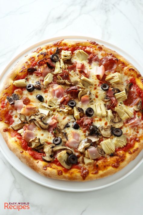 Learn how to make a delicious and authentic Italian Pizza Capricciosa, a classic pizza topped with ham, artichokes, mushrooms, and olives. This traditional Italian recipe is perfect for a homemade pizza night! Italian Donuts Recipe, Parmigiana Recipe, Italian Donuts, Italian Main Dishes, Italian Snacks, Authentic Italian Pizza, Homemade Pizza Crust, Chicken Cacciatore Recipe, Italian Pizza Recipe