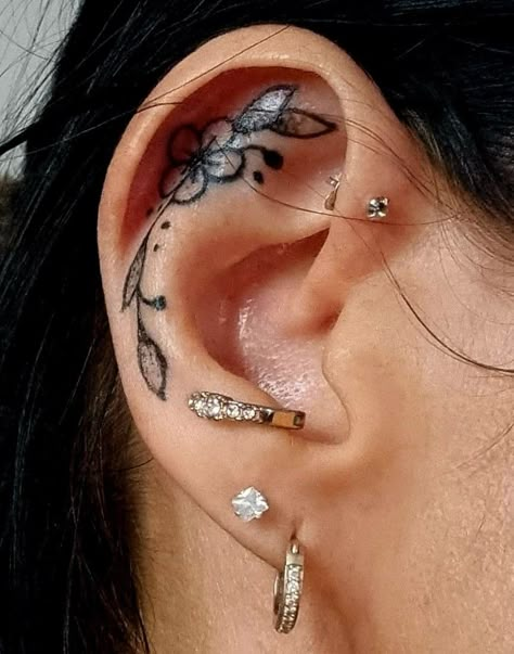 Unique Ear Tattoo Ideas, Decorative Ear Tattoo, Inner Ear Tattoos For Women Flower, Chakra Ear Tattoo, Inside Ear Tattoos Flower, Flower Ear Tattoo With Piercing, Inner Ear Tattoo, Unique Wrist Tattoos, Thumb Tattoos