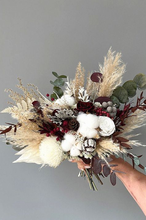 Another seasonal bouquet feels perfect for your special day. Speaking from experience, this bouquet completes your bridal look. Keep this inspiration to your winter bouquet ideas. Xmas Bouquets, Winter Boho Wedding, Wedding Table Place Settings, Winter Bridal Bouquets, Garden Wedding Bouquet, Wedding Flower Design, Flower Cake Toppers, Flower Girl Bouquet, Winter Wedding Bouquet