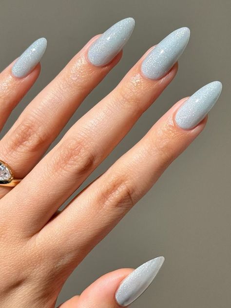 25 Stunning Blue Winter Nails to Inspire Your Next Manicure Icy Blue Manicure, Light Blue Pastel Nails, Sparkle Light Blue Nails, Baby Blue Holiday Nails, Frosty Nails Blue, Frost Nails Winter, Pale Blue Christmas Nails, Ice Blue And Silver Nails, Baby Blue Bow Nails