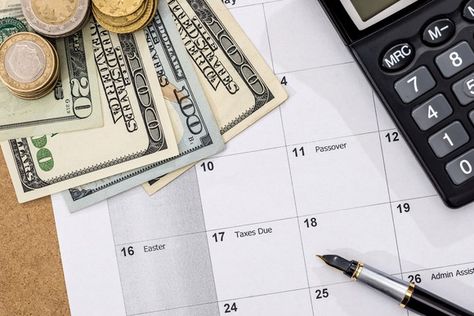 A calendar with dollars, coins, a pen and a calculator on it. Need Money Fast, Auto Loans, Mortgage Lender, Payday Loans Online, Money Lender, Easy Loans, Quick Loans, Loan Company, Easy Cash