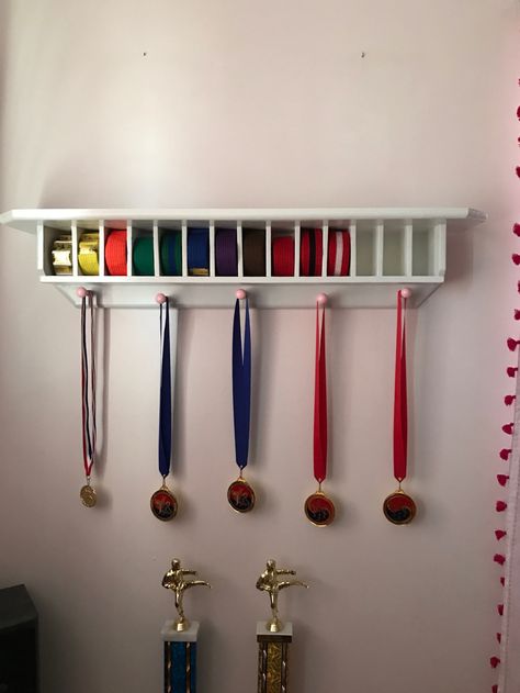 Belt display shelf! Wonderful gift from a handy grandpa! Gi Belt Display, Karate Belt Display Diy, Belt Display Ideas, Taekwondo Belt Holder, Belt Display Diy, Diy Display Shelves, Taekwondo Belt Display, Diy Display Shelf, Belt Display Rack