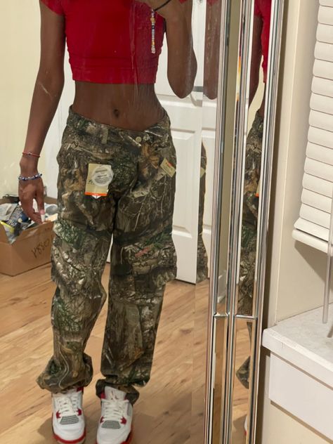 Hunting Cargo Pants Outfit, Hunter Pants Outfit, Red Shirt And Camo Pants Outfit, Outfit Ideas With Army Fatigue Pants, Camouflage Pants Outfits For Women, Outfits With Camo Cargo Pants, Forest Print Pants Outfit, Hunting Pants Outfit, Camo And Red Outfit