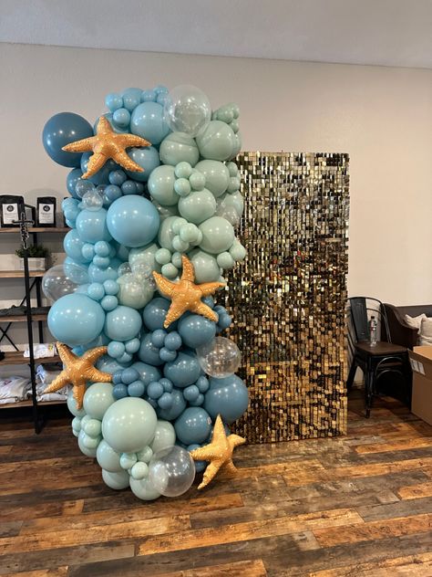 Blue Sequin Backdrop, Under The Sea Prom Ideas, Beachy Balloon Arch, Ocean Theme Balloon Garland, Underwater Theme Decor, Beach Theme Sweet 16 Ideas, Under The Sea Formal Theme, Ocean Theme Balloon Arch, Under The Sea Birthday Party Decorations Backdrops Ocean Themes