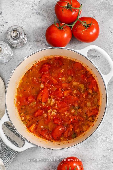 Making stewed tomatoes at home yields deeper and more savory tomatoes than their canned counterparts. And this recipe is so easy to make. Just chop some tomatoes and add them to a pot along with some celery, onion, garlic, basil, and peppers. Allow it to simmer for a while. Then the sauce can be used for soups, stews, marinara, or chicken parmesan. #spendwithpennies Canned Tomatoes With Onions And Peppers, Frozen Stewed Tomatoes, Recipes With Stewed Tomatoes, Stewed Tomatoes Recipe, Stewed Tomato Recipes, Canning Stewed Tomatoes, Canned Stewed Tomatoes, Tomato Side Dishes, Celery Recipes