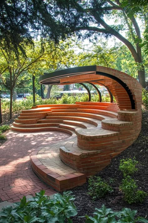 Curved brick seating area with lush greenery overhead. Pavilion designs are transforming garden sheds into architectural wonders with the flair of a peacock in a tuxedo. Pavilion Seating Design, Garden Pavilion Architecture, Pavilion Architecture Public Spaces, Modern Pavilion Design, Brick Seating, Sheltered Seating, Public Pavilion, Amphitheater Architecture, Red Brick Building