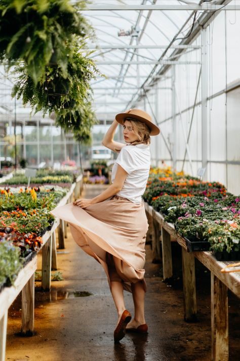 Greenhouse model photoshoot Garden Model Photography, Garden Nursery Photoshoot, Greenhouse Photoshoot Ideas, Posing With Plants, Greenhouse Picture Ideas, Garden Center Photoshoot, Greenhouse Editorial, Plant Nursery Photoshoot, Garden Poses Instagram