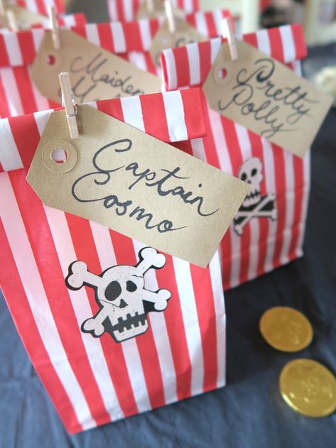 Pirate Party Ideas — Pirate Loot Party Favours — we made pirate 'loot' bags out of red and white striped gift bags secured with a tiny wooden peg. They fit the pirate theme so well and were roomy enough for lots of pirate related gifts. #pirateparty #piratepartyideas Pirate Birthday Party Ideas, Kids Pirate Party, Girl Pirate, Bus Party, Turning Three, Pirate Party Favors, Pirate Themed Birthday Party, Boy Cakes, Pirates Party