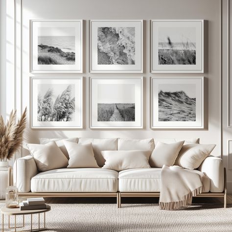 Transform your living space into a serene coastal retreat with this set of 6 black and white printable gallery wall photographs. Each image beautifully captures the timeless essence of beach life, from delicate pampas grass swaying in the breeze to peaceful seascapes and the intricate textures of sand dunes. These art prints bring a calming coastal ambiance into any room, making them the perfect addition to coastal-themed interiors or beach houses. When you purchase this set, you'll receive versatile files that cater to different framing needs. Included are portrait-oriented prints with a white border, perfect for standard frames, as well as square files without a border, ideal for those who already have frames with a mat. This allows you to customize your gallery wall to suit your persona 6 Square Frame Gallery Wall, Costal Wall Art, Black And White Gallery Wall Photographs, Black And White Framed Photos On Wall, White Picture Frame Wall, Living Room Wall Gallery, Calming Coastal, Dc Apartment, Hamptons Decor