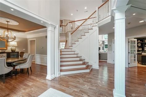 There is a sun room off of the great room that used to have a tile floor and dark navy walls (which I don’t mind – you know me and navy). Updating Traditional Home, Indoor Columns, Columns Interior, House Columns, 90s House, Columns (home), Chateaux Interiors, 90s Home, Craftsman Interior