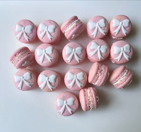 Light pink shells with white bows. I love classic themes 🎀 Vanilla, strawberry, and salted caramel macarons decorated with royal icing . . . . #macarons #macaron #frenchmacarons #dessert #desserts #fyp Light Pink Macarons, Pink Bow Desserts, Princess Desserts, Salted Caramel Macarons, 1st Birthday Foods, Caramel Macarons, Coquette Birthday, Pink Shells, Pink Macarons