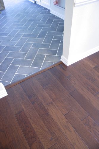 Good idea for wood floor in the living room/ tile around the fireplace Grey Wood Tile, Grey Wood Floors, Farmhouse Flooring, Living Room Tiles, Quickstep, Wood Tile Floors, Herringbone Tile, Hardwood Tile, Room Tiles