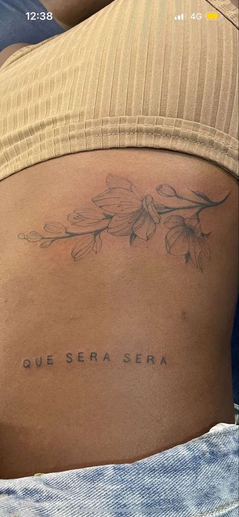 All In All Is All We Are Tattoo, Che Sera Sera Tattoo, Tattoos About Perspective, Que Sera Sera Tattoo With Flower, Lo Que Sera Sera Tattoo, Pretty Soul Tattoo, Que Sera Sera Tattoo Ideas, Rebirth Tattoo Ideas, Simple Shoulder Tattoos For Women