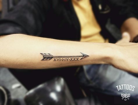 Arrow tattoo with Roman date Arrow Tattoo With Date, Arrow With Date Tattoo, Date Ideas Tattoo, Roman Numeral Arrow Tattoo, Arrow Tattoo Design For Men, Arrow Tattoo Men, Golden Spiral Tattoo, Mens Arrow Tattoo, Arrow Forearm Tattoo