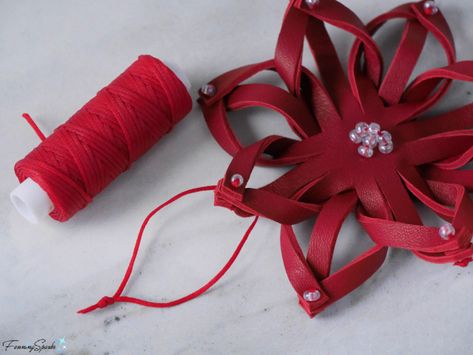 Attach Hanger to Leather Snowflake @FanningSparks Red Leather Snowflake Ornament – DIY Tutorial – FanningSparks Christmas Leather Crafts, Leather Scraps Ideas Projects, Leather Ornaments Diy, Faux Leather Christmas Ornaments, Diy Leather Snowflake, Leather Christmas Ornaments Diy, Leather Christmas Decorations, Leather Diy Projects, Leather Scraps Ideas