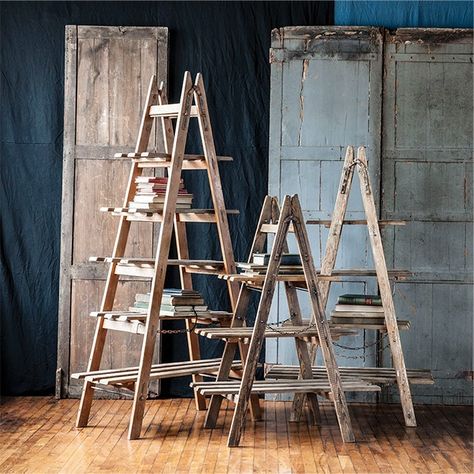 Beyond its decorative potential, our A Frame Folding Display Ladder is also a functional storage solution. Display rolled towels, soaps, or baskets in a bathroom or showcase a vase of flowers, photo frames, or a candle display in a bedroom. The versatility of this ladder allows you to maximize your space while adding an element of contemporary design. Available in three sizes. Christmas Ladders Ideas, Display Ladder, Shelf Ladder, Ladder Ideas, Ladder Display, Drainage Ditch, Farmhouse Stools, Flea Market Booth, Wooden Centerpieces